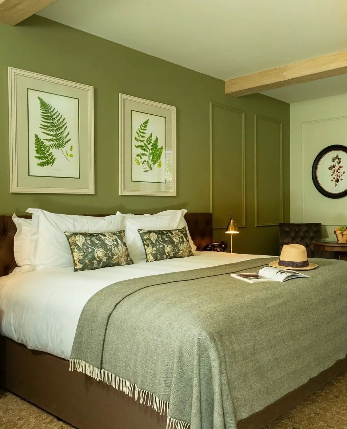 Botanical prints framed in a hotel bedroom, Fernhill House