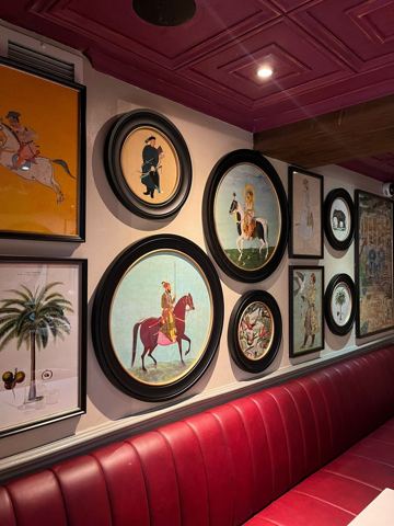 Framed artwork installed in a restaurant